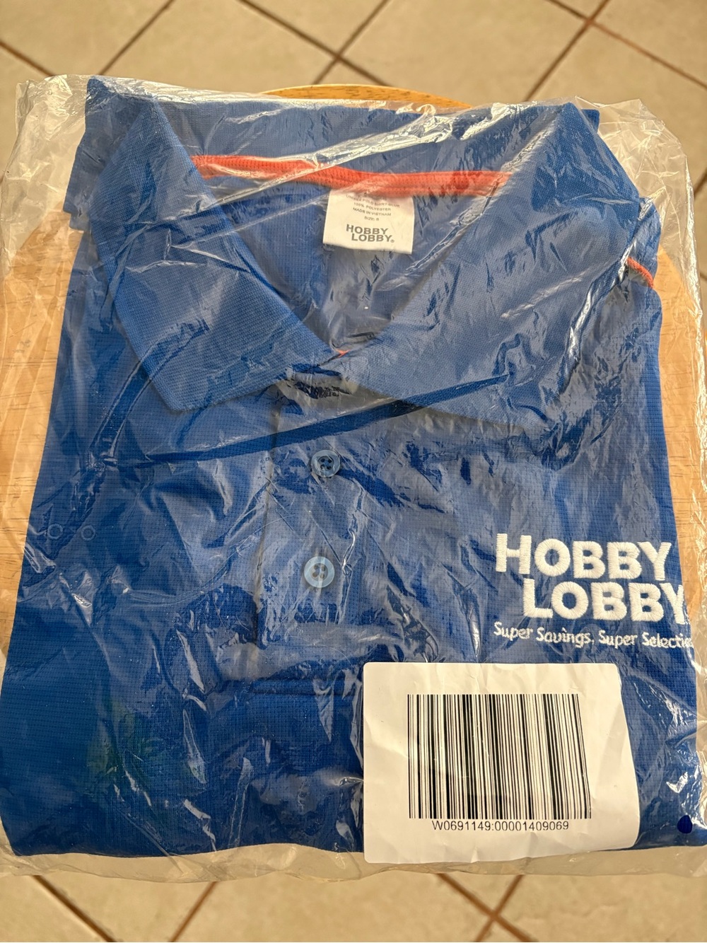Hobby Lobby Royal Blue Polo with White Logo and Orange Trim